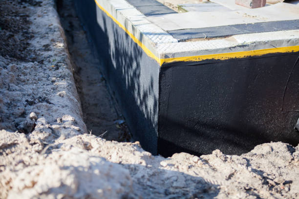 Professional Basement Waterproofing technician working in Bellwood, IL